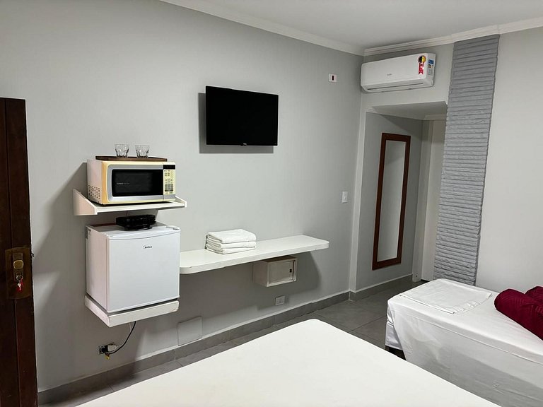hotel frente ao mar enseada - delphin 111
